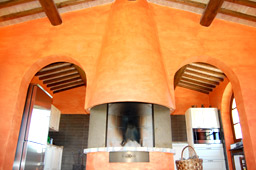 interior of the restaurant of tuscan villa with fireplace