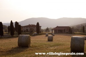 villa in tuscany with haystacks